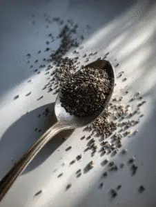 Chia seeds benefits shown with dry seeds on metal spoon