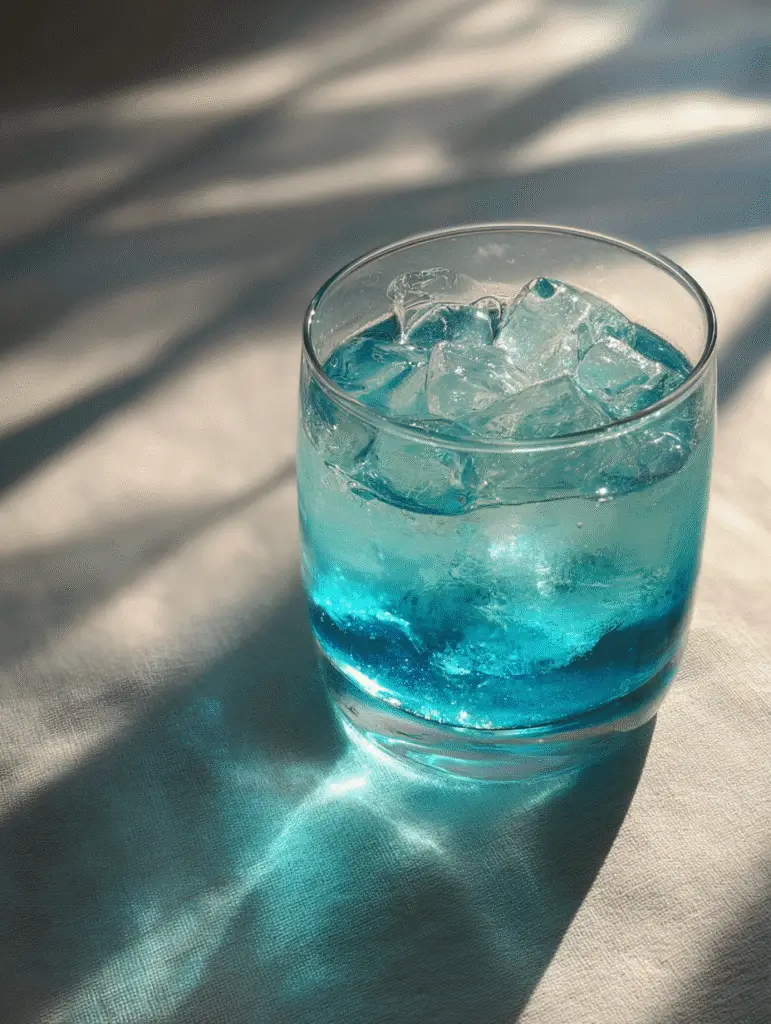 Blue Salt Trick: What It Is, And How It Works Refreshing glass showing the blue salt trick with sparkling effect.