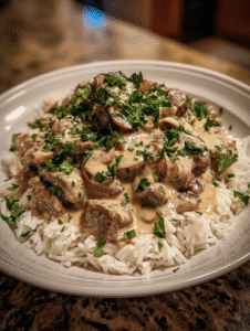 Beef stroganoff recipe with creamy mushroom sauce over rice