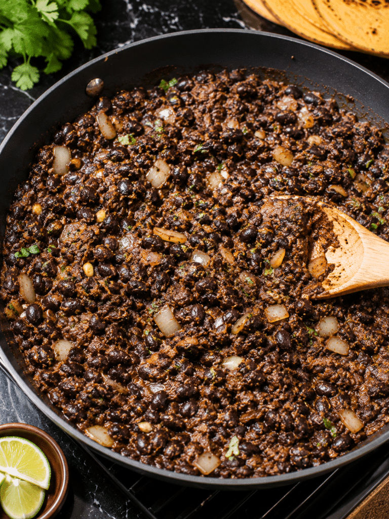 Crispy Black Bean Tacos That Turn Golden and Crunchy Every Time Cooking black bean taco filling in skillet