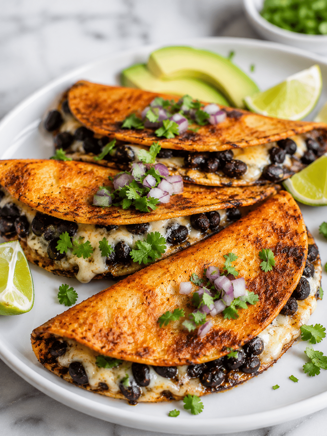 Crispy black bean tacos with avocado and cilantro