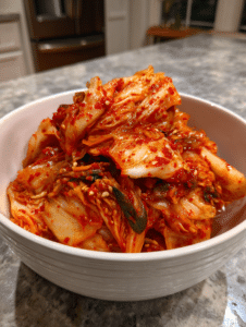 fermented cabbage kimchi in rustic bowl