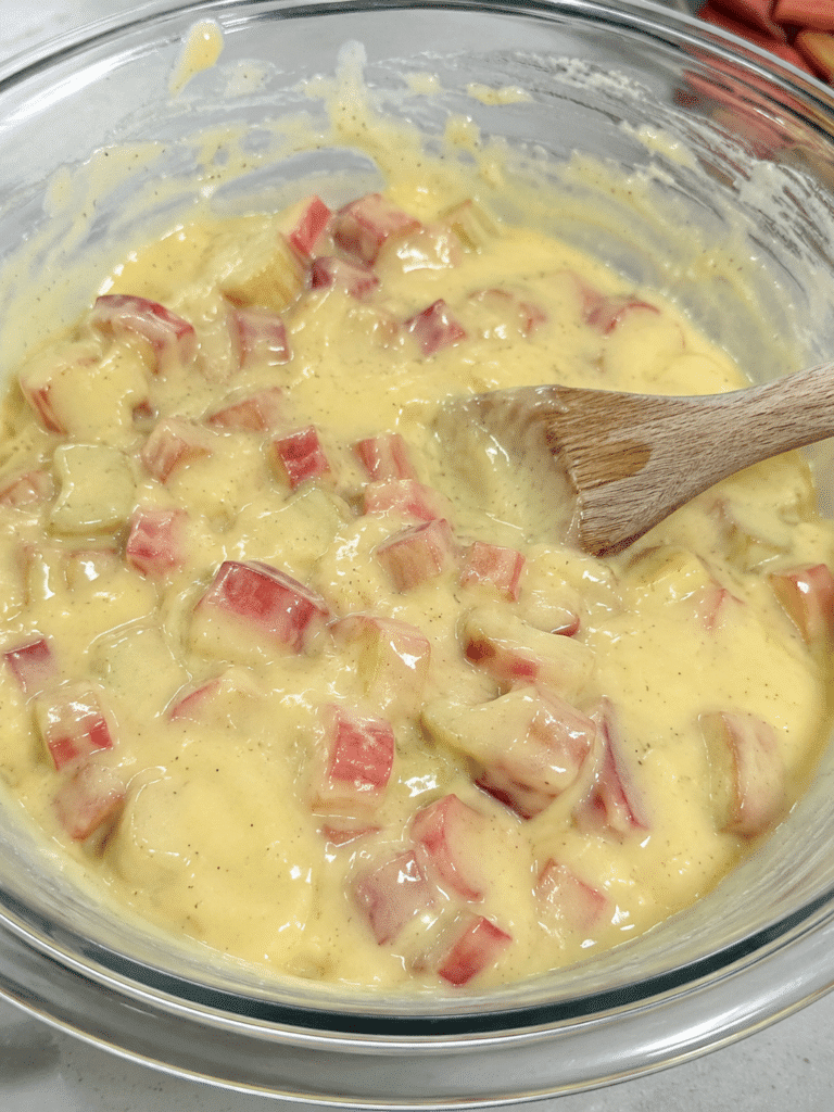 preparing filling for rhubarb custard bars recipe