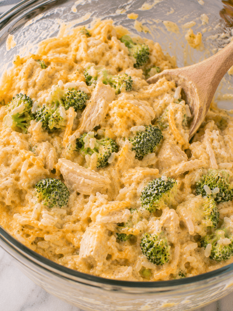 Chicken Broccoli Rice Cheese Casserole: Easy, Cheesy Family Favorite Mixing chicken broccoli rice cheese casserole filling