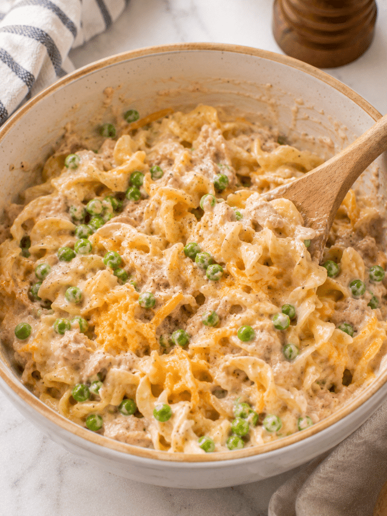 Mixing tuna noodle casserole recipe filling before baking